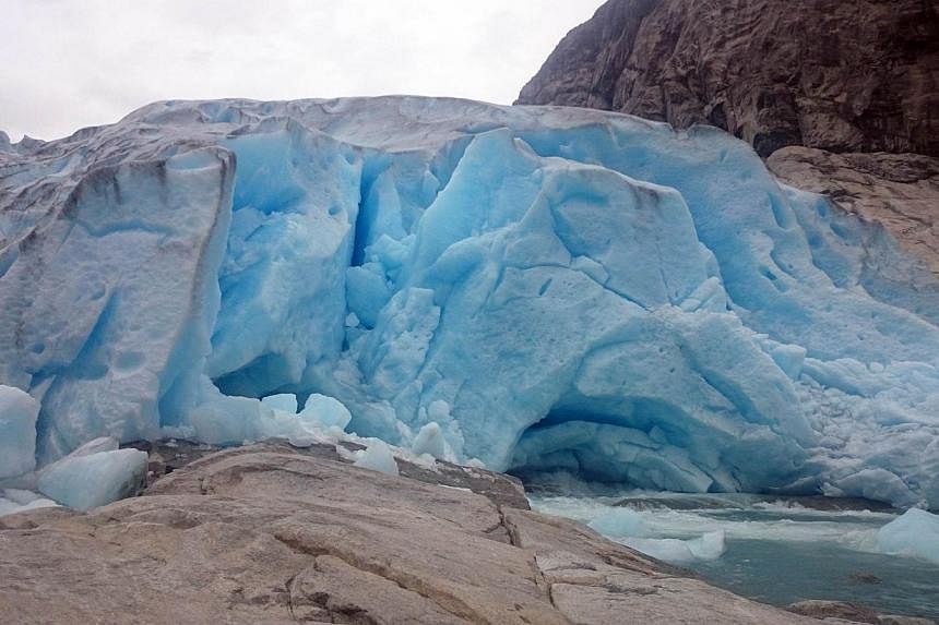 Picture taken on August 10, 2014 shows a glacier in Luster, Norway.&nbsp;A German couple died in front of their two young children when ice broke during a tour of a melting Norwegian glacier, police said Monday. -- PHOTO: AFP