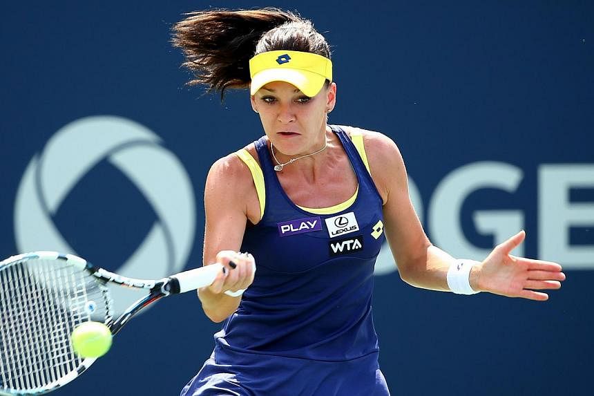 Third seed Agnieszka Radwanska of Poland returns a shot to Venus Williams of the US during the women's final of the&nbsp;Rogers Cup in Montreal, Canada,&nbsp;on August 10, 2014, setting herself up as a player to watch at the upcoming US Open. -- PHOT