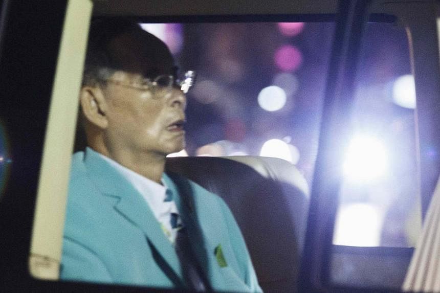 Thailand's King Bhumibol Adulyadej arrives in a van at Siriraj hospital in Bangkok August 6, 2014. &nbsp;The palace on August 11, 2014 said the 86-year-old monarch is in good overall health, with doctors administering medicine to tackle stomach infla