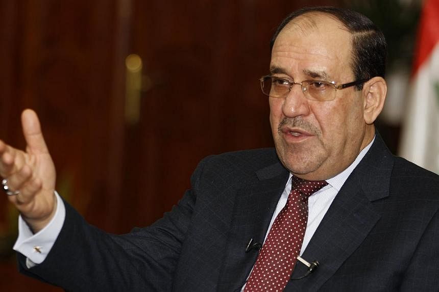 Iraqi Prime Minister Nouri al-Maliki indicated that he will not drop his bid for a third term and accused the president of violating the constitution in a tough televised speech likely to deepen political tensions as a Sunni insurgency rages. -- PHOT