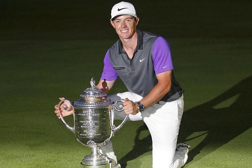 Rory McIlroy of Northern Ireland poses with the Wanamaker Trophy after winning the 2014 PGA Championship at Valhalla Golf Club in Louisville, Kentucky, on Aug 10, 2014. -- PHOTO: REUTERS