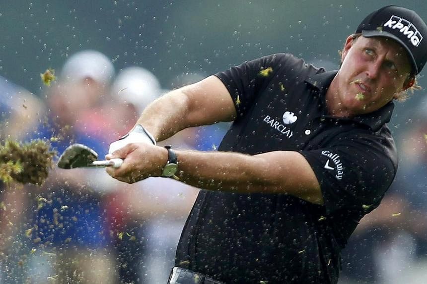 Phil Mickelson of the U.S. hits off a wet fourth fairway during the final round of the 2014 PGA Championship at Valhalla Golf Club in Louisville, Kentucky, on Aug 10, 2014.&nbsp;Phil Mickelson settled for second place to Rory McIlroy on Sunday at the