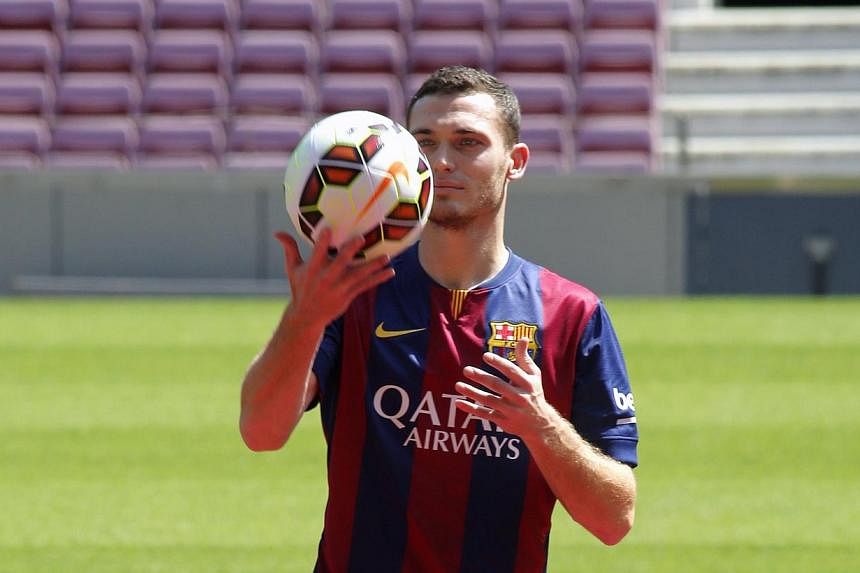 Belgium soccer player Thomas Vermaelen is pictured during his presentation at Nou Camp stadium in Barcelona, on Aug 10, 2014.&nbsp;Barcelona's new signing Thomas Vermaelen has an injured right hamstring and is not yet ready to start training, the Spa