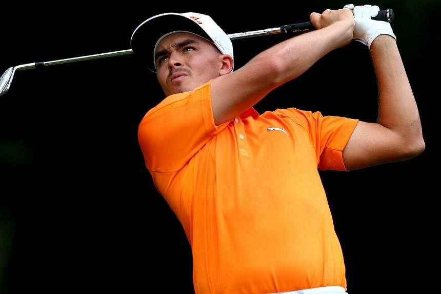 Rickie Fowler of the United States hits his tee shot on the third hole during the final round of the 96th PGA Championship at Valhalla Golf Club&nbsp;in Louisville, Kentucky&nbsp;on Aug 10, 2014. -- PHOTO: AFP&nbsp;