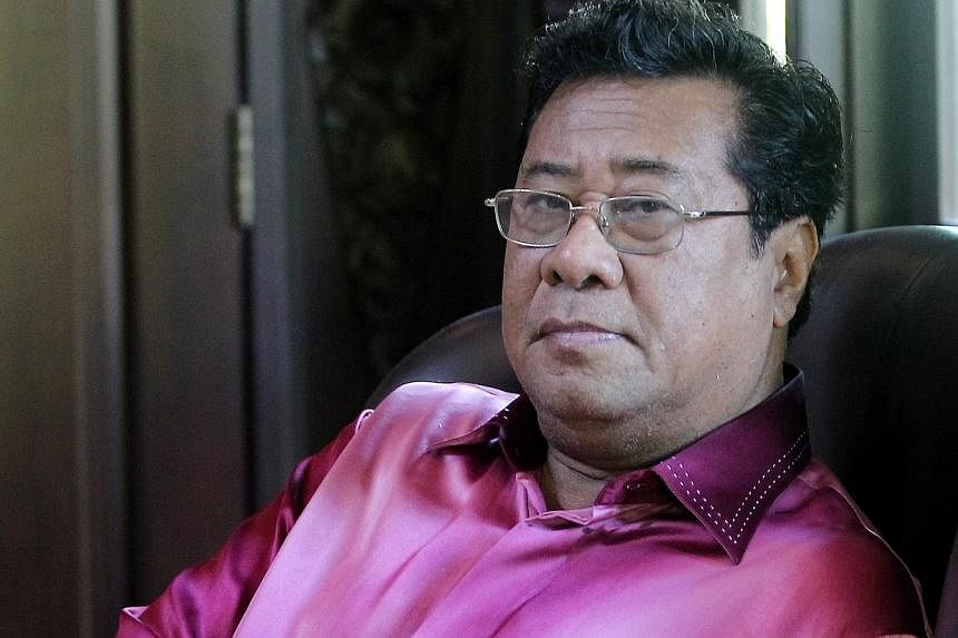 Tan Sri Khalid Ibrahim may be hanging on by a thread to the Selangor Mentri Besar's post, but he is not about to step down any time soon. -- PHOTO: THE STAR/ASIA NEWS NETWORK&nbsp;