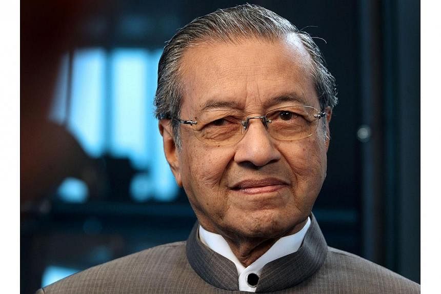 Influential Malaysian former prime minister Mahathir Mohamad on Tuesday, Aug 12, 2014, criticised the takeover of crisis-hit Malaysia Airlines by the country's sovereign wealth fund as a recipe for more losses by the carrier. -- PHOTO: BLOOMBERG