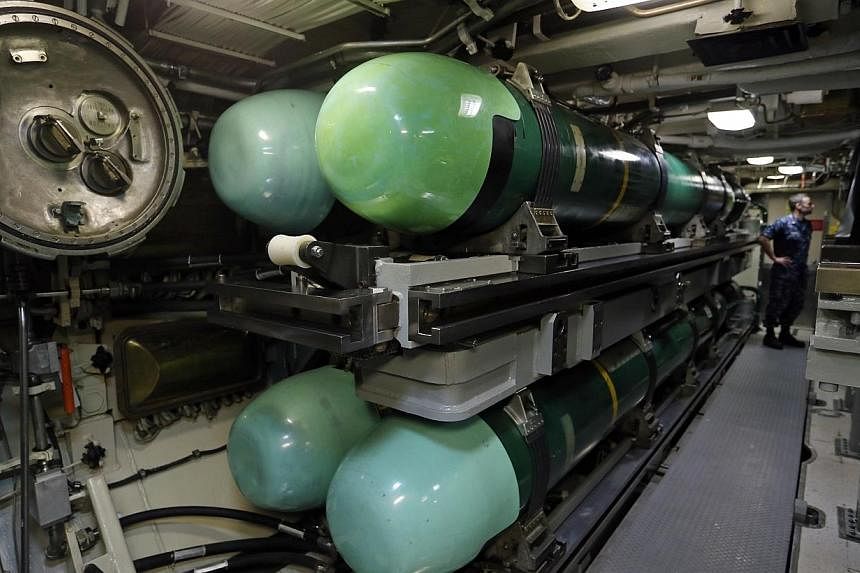 Torpedoes lie stacked in the USS Michigan. -- ST PHOTO: SEAH KWANG PENG