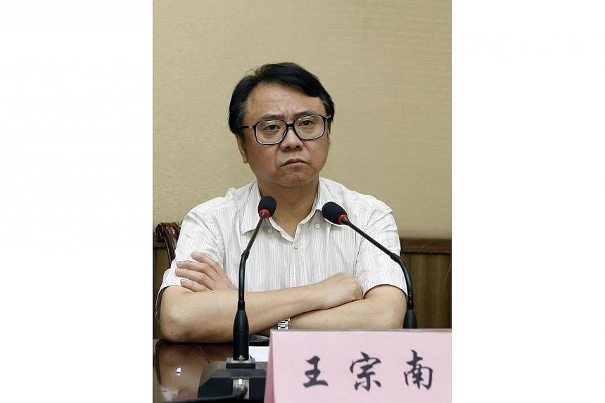 Businessman Wang Zongnan attending a meeting in Shanghai on July 30, 2012.&nbsp;Chinese prosecutors have ordered the arrest of Wang, the former chairman of state-owned Bright Food Group Co Ltd on suspicion of bribe-taking and embezzling public funds.