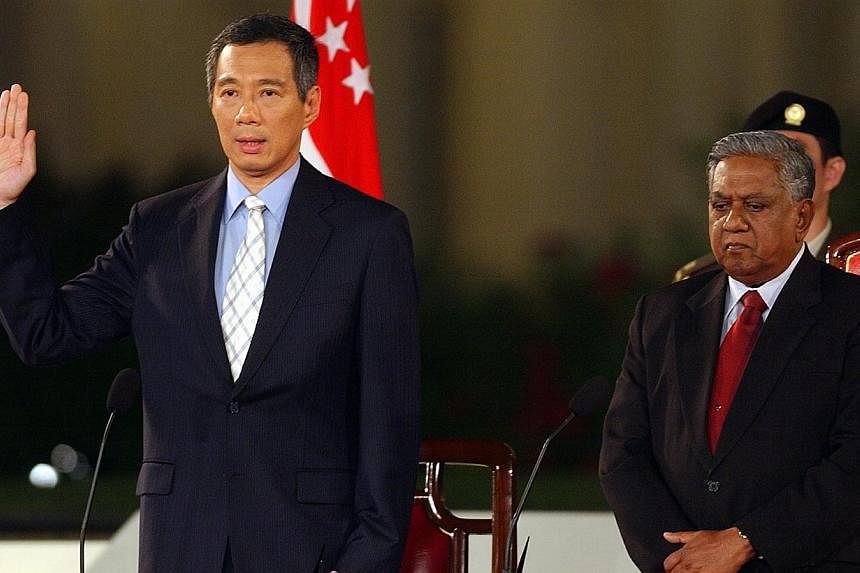 Mr Lee Hsien Loong at his swearing in ceremony on Aug 12, 2004. (Former president S.R. Nathan is on his left). -- PHOTO: ST FILE