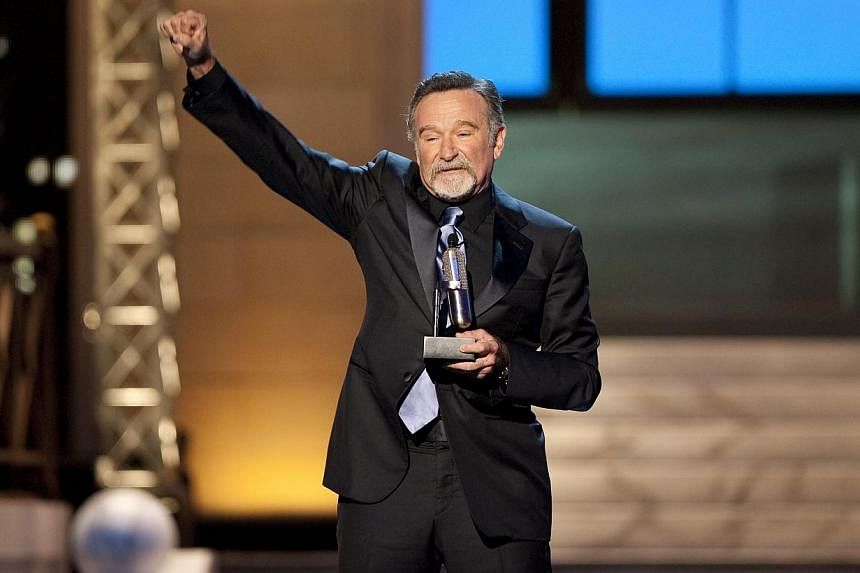 Robin Williams reacts after receiving the Stand Up Icon Award during the second annual 2012 Comedy Awards in New York on April 28, 2012. -- PHOTO: REUTERS&nbsp;