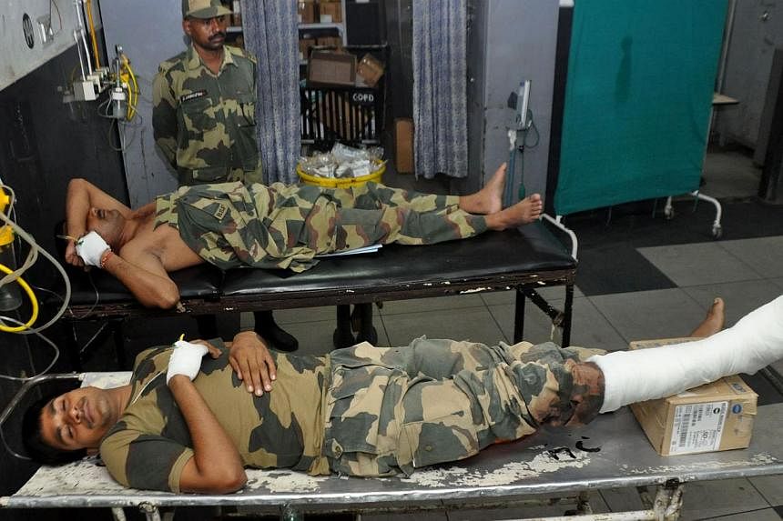 Indian Border Security Force soldiers injured in cross-border firing undergo treatment at the Government Medical College Hospital in Jammu on August 11, 2014. India police on August 11, 2014 accused Pakistan of injuring four people during firing alon