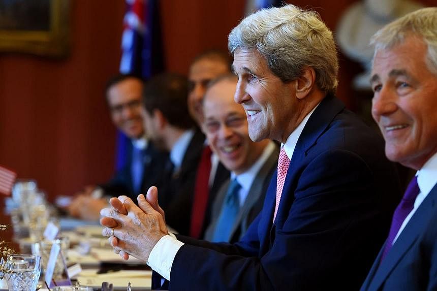 US Secretary of State John Kerry (second from right) and Secretary of Defence Chuck Hagel (right) take part in talks at Admiralty House in Sydney on August 12, 2014. -- PHOTO: AFP