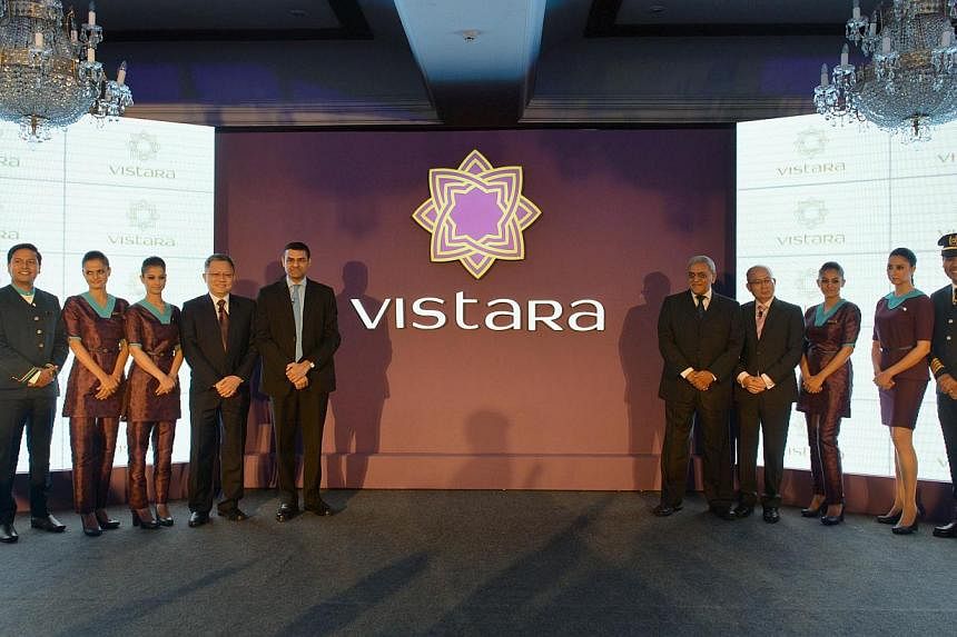 Staff members of TATA SIA Airlines Limited (TSAL) pose during the launch of the new brand name 'Vistara' - a Sanskrit word denoting limitless expanse - for the new airline in New Delhi on August 11, 2014. --PHOTO: AFP&nbsp;