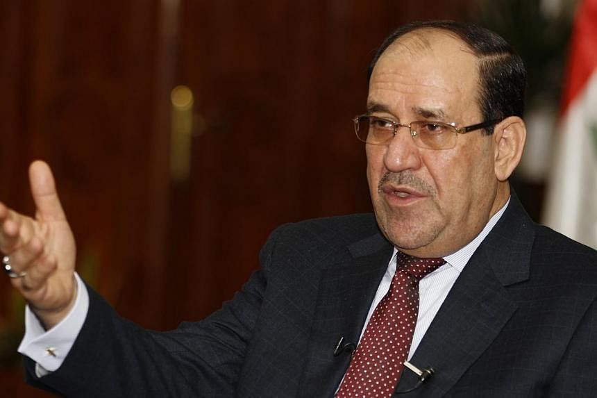 Iraq's Prime Minister Nuri al-Maliki speaks during an interview with Reuters in Baghdad on Jan 12, 2014.&nbsp;Iraq's caretaker prime minister Nuri al-Maliki said Wednesday, Aug 13, 2014, that it will take a federal court ruling for him to leave power
