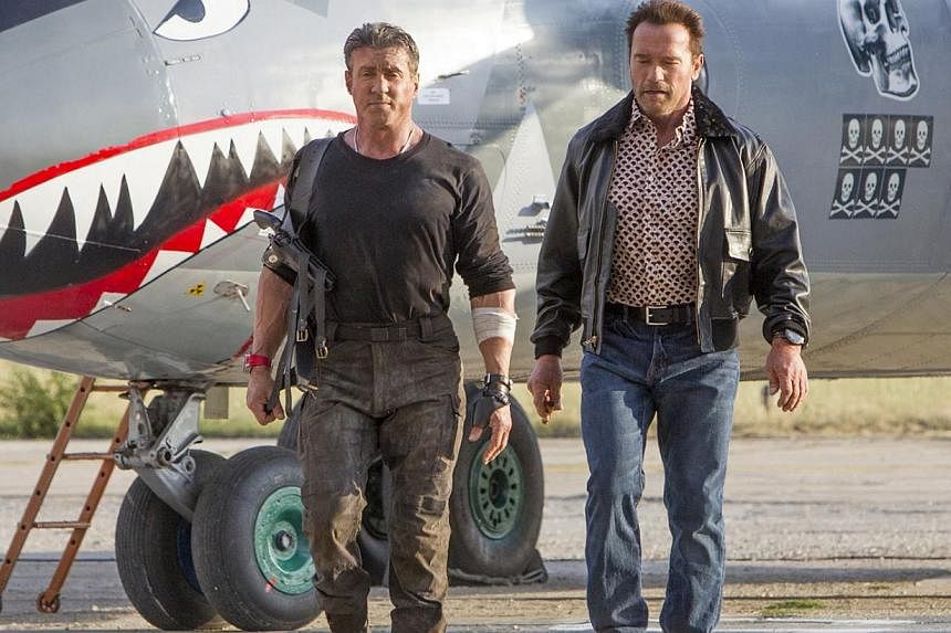 Sylvester Stallone (left) and Arnold Schwarzenegger (right) reprise their roles in The Expendables 3.