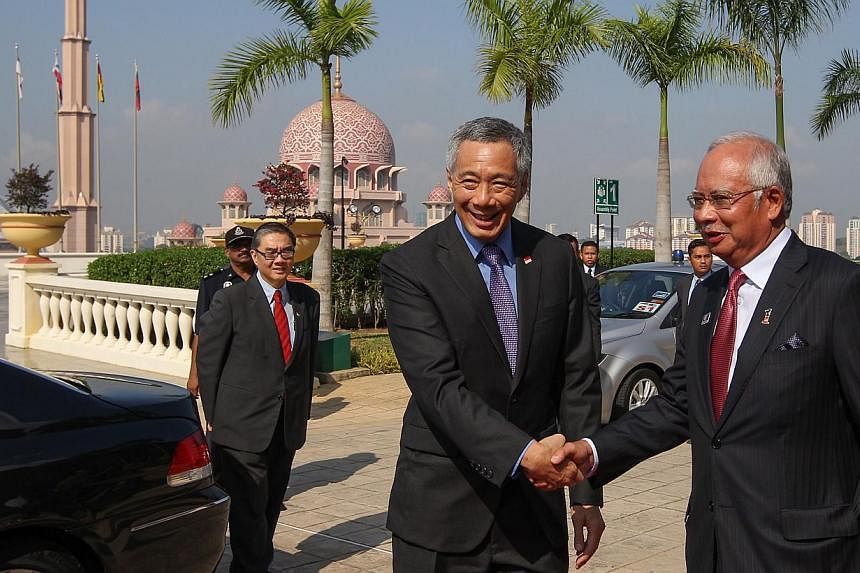 Prime Minister Lee Hsien Loong with Malaysia's Prime Minister Najib Razak at the Malaysia-Singapore Leaders' Retreat in Putrajaya in April. Mr Lee and Datuk Seri Najib enjoy a warm relationship and their resolution of a long-standing dispute over Mal