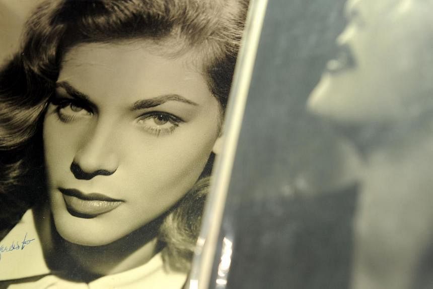 This April 14, 2011 file photo shows a signed photograph of Lauren Bacall at Bonhams and Butterfields in Los Angeles, California, during a preview before an auction on April 20, 2011. -- PHOTO: AFP