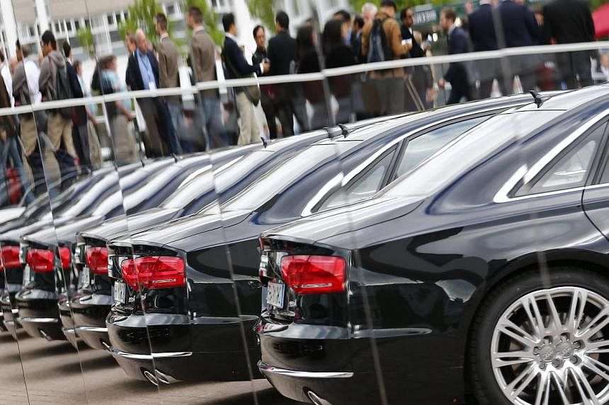 File photo of Audi cars reflected in mirrors during a media preview day at the Frankfurt Motor Show (IAA) Sept 10, 2013.&nbsp;More than 1,000 companies in China's auto sector, both domestic and foreign, are "involved" in anti-monopoly probes by the g