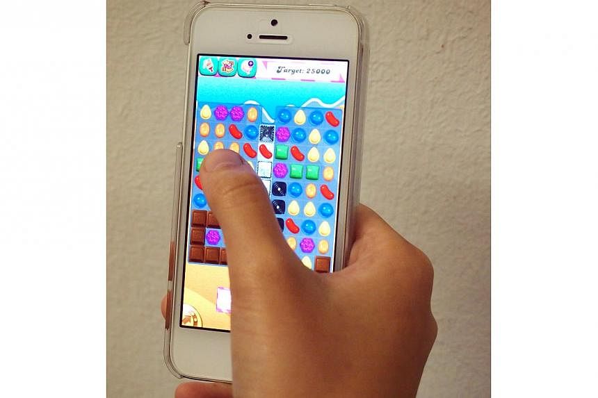 The Candy Crush game shown on a mobile phone.&nbsp;-- PHOTO: THE NEW PAPER FILE&nbsp;