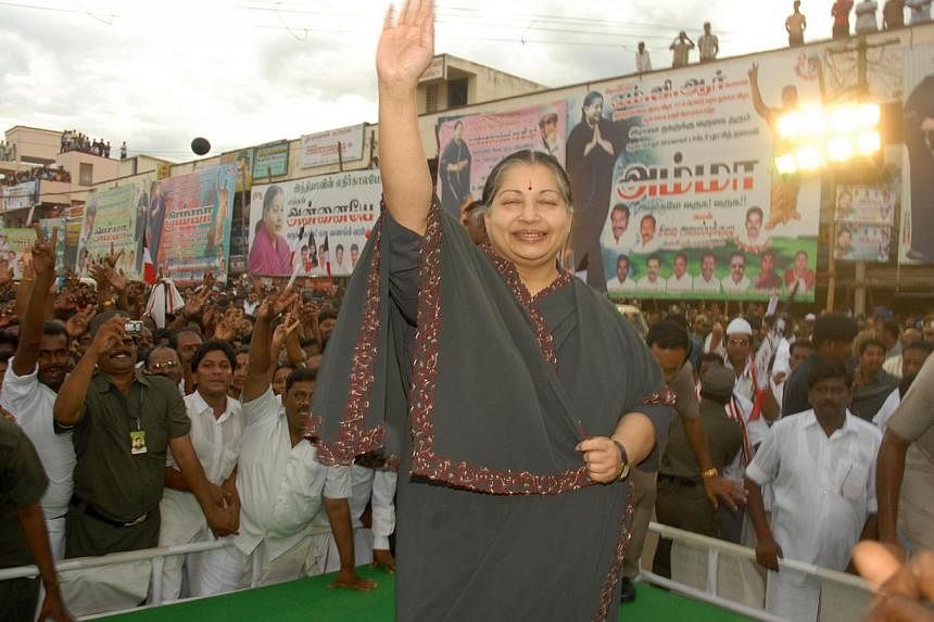 Tamil Nadu Chief Minister J. Jayalalithaa, seen here in a file photo greeting supporters, denounced as "sartorial despotism" the Tamil Nadu Cricket Association's refusal to allow a judge entry because he was wearing a traditional dhoti -&nbsp;a piece