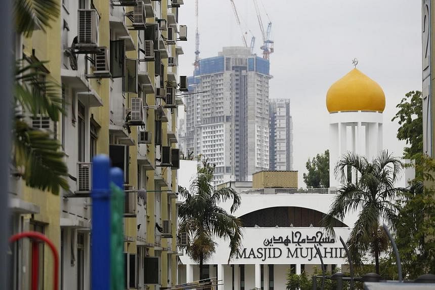 The Masjid Mujahidin, located along Queensway (Stirling Road), as photographed on July 27, 2014. Queenstown, the country's first satellite estate, will get a network of six neighbourhood heritage corners, and galleries across several void decks, walk