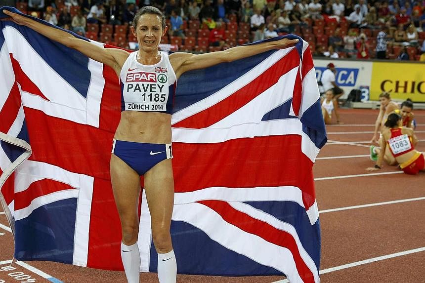 Jo Pavey of Britain celebrates after winning the women's 10,000m race during the European Athletics Championships at the Letzigrund Stadium in Zurich August 12, 2014. Pavey, who is 41 next month, is the oldest female to claim a gold medal at the Euro
