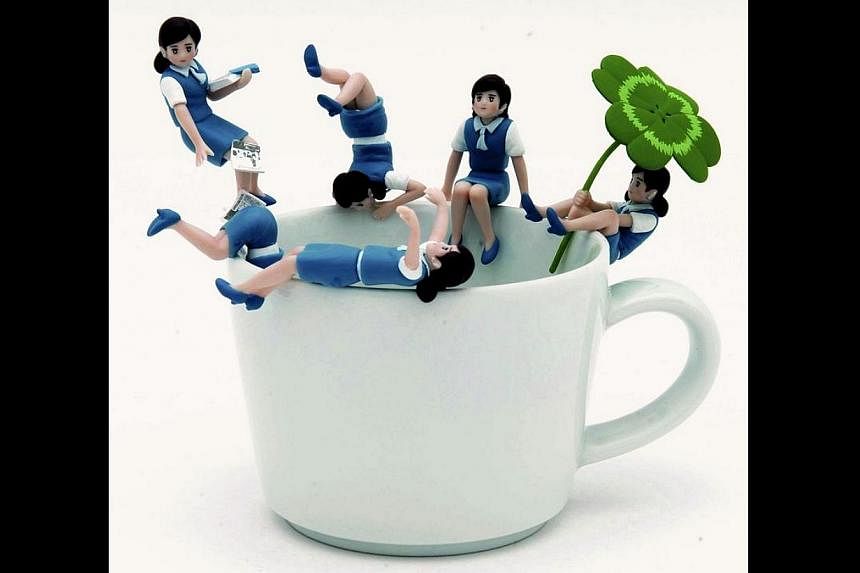 Koppu No Fuchiko, or Fuchiko on the edge of the cup, has been a hit since it was introduced for sale in July 2012. The 5cm tall&nbsp;plastic figurine of a young woman wearing a typical office uniform designed to sit, dangle, do a headstand, or strike
