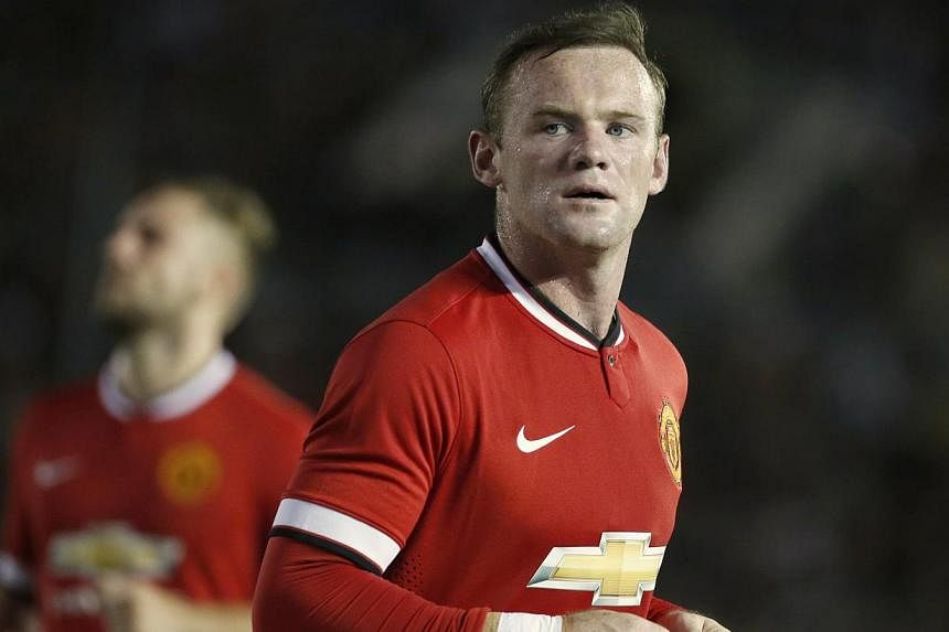 New Manchester United manager Louis van Gaal has given England striker Wayne Rooney the role of team captain and made Scotland midfielder Darren Fletcher his vice-captain. -- PHOTO: REUTERS