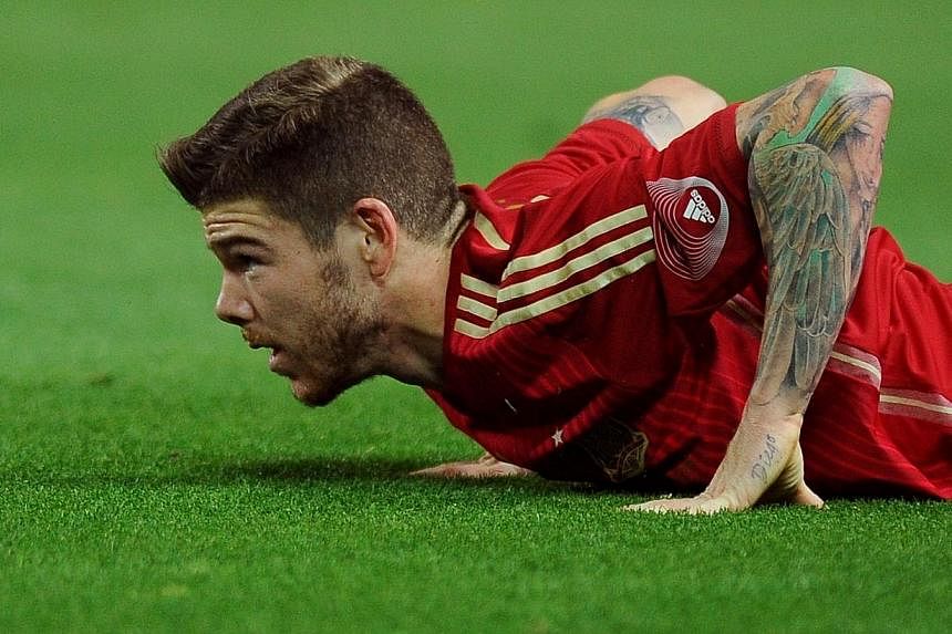 Spain's defender Alberto Moreno looks up from the field during the international friendly football match Spain vs Bolivia at the Ramon Sanchez Pizjuan stadium in Sevilla on May 30, 2014. -- PHOTO: AFP