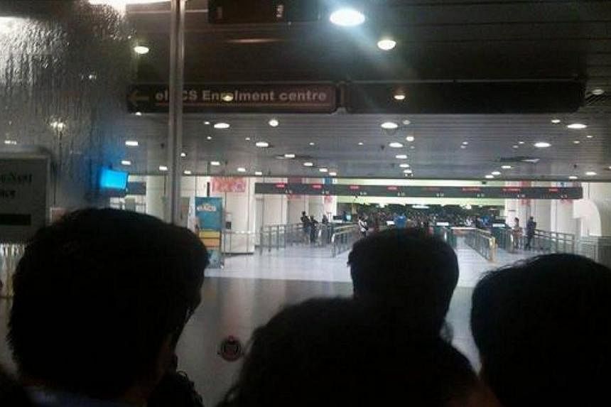 Users on social media platforms such as Facebook and Twitter uploaded pictures of crowds stuck both outside and inside the checkpoint. -- PHOTO: TWITTER/@PSI_SINGAPORE&nbsp;
