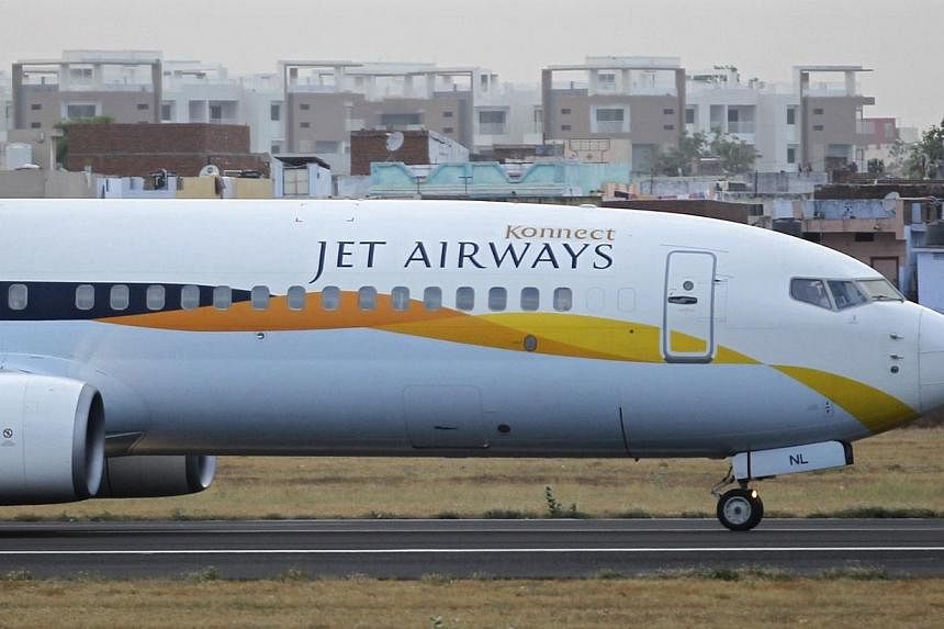 A Jet Airways passenger plane moves along the tarmac at the Sardar Vallabhbhai Patel international airport in the western Indian city of Ahmedabad on April 24, 2013.&nbsp;India's civil aviation regulator said it has ordered Jet Airways to suspend two