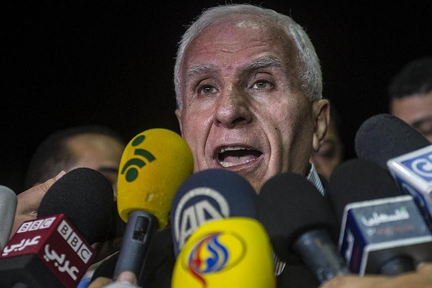 Head of the Palestinian delegation Azzam al-Ahmed gives a press conference at a hotel in Cairo late on Aug 13, 2014. -- PHOTO: AFP
