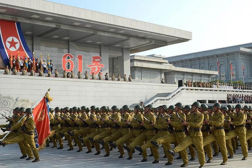 Military personnel march during an event at the plaza of the Kumsusan Palace of the Sun marking the 61st anniversary of the armistice that ended the Korean War taken on July 27, 2014 in this photo released by North Korea's Korean Central News Agency 