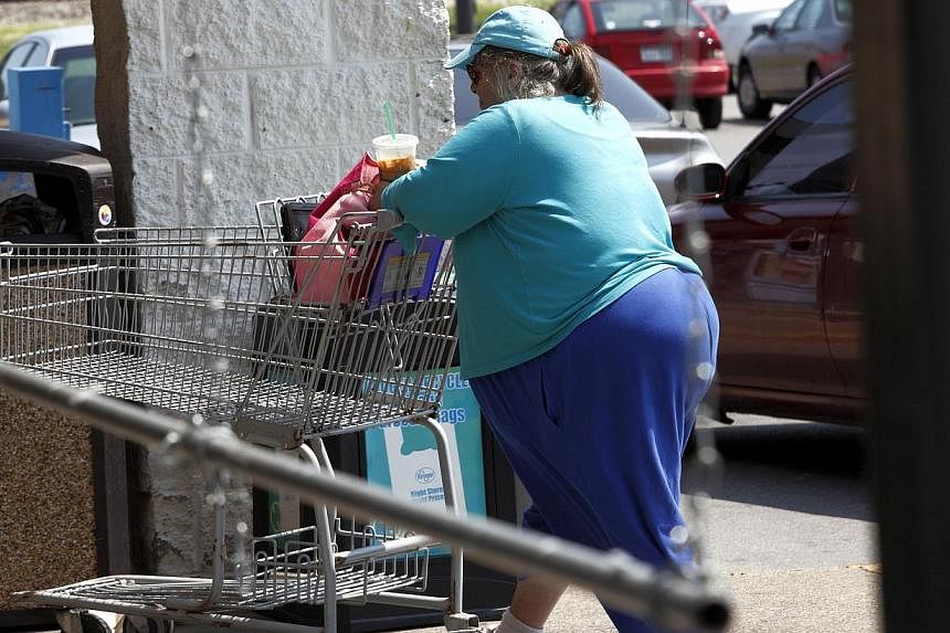 An overweight Huntington resident heads into a local supermarket for groceries. -- PHOTO: ST FILE