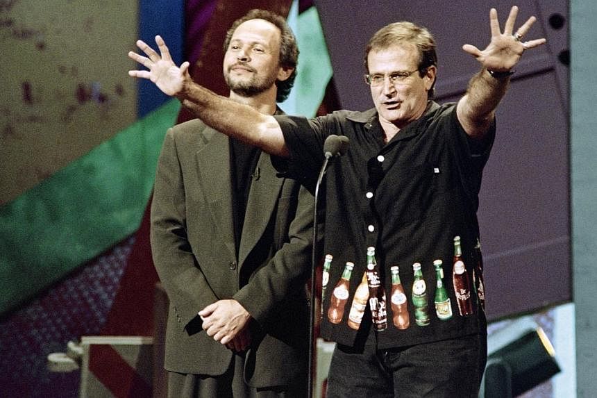 A file picture taken on Nov 11, 1995, in Universal City, shows US actors Robin Williams (right) and Billy Crystal taking part in the HBO's Comic Relief VII to raise money for the nation's homeless.&nbsp;From an eccentric alien to an animated blue gen