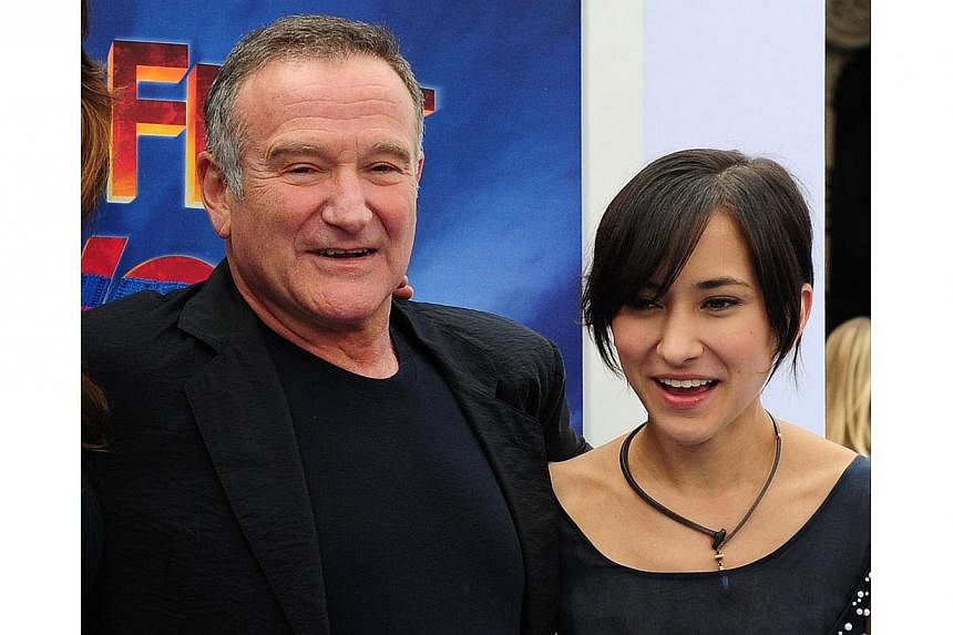 In this November 13, 2011 file photo, US actor and comedian Robin Williams and his daughter Zelda pose on arrival for the world premiere of the movie Happy Feet Two in Hollywood, California. According to media outlets on August 13, 2014 Zelda William