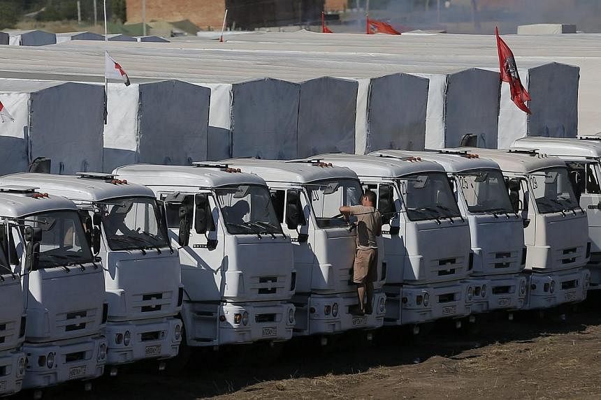 A Russian convoy of trucks carrying humanitarian aid for Ukraine is parked at a camp near Kamensk-Shakhtinsky, Rostov Region on Aug 15, 2014.&nbsp;Ukrainian officials were preparing to inspect a massive Russian "aid" convoy bound for the conflict-tor