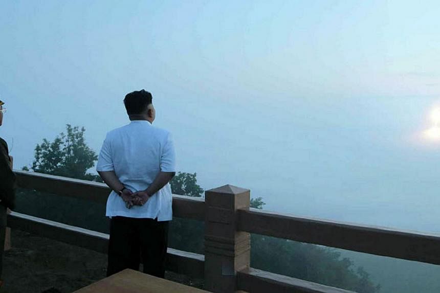 This picture shows North Korean leader Kim Jong-Un (RIGHT) observing a tactical rocket launch. North Korea suggested on Friday that a series of rocket tests that coincided with the arrival of Pope Francis in South Korea were actually conducted to mar