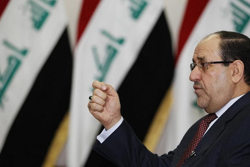 Iraq's Prime Minister Nuri al-Maliki speaks during an interview with Reuters in Baghdad in this Jan 12, 2014 file photo.&nbsp;The White House welcomed Nuri al-Maliki's decision on Thursday to drop his bid to remain Iraq's prime minister as a "major s