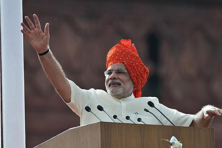 India's Prime Minister Narendra Modi waves at the end of his speech from the Red Fort to mark the country's 68th Independence Day in New Delhi on Aug 15, 2014.&nbsp;Modi voiced dismay on Friday at the government in-fighting he found on assuming offic