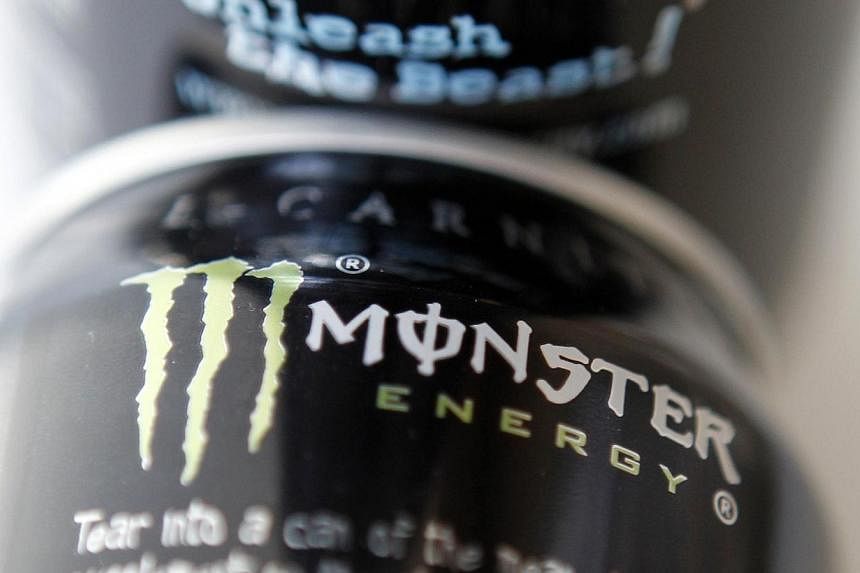 Two cans of Monster energy drink are shown in this file photo illustration in Los Angeles on Oct 23, 2012.&nbsp;Coca-Cola announced Thursday it will pay US$2.15 billion (S$2.68 billion) for a 16.7 per cent stake in Monster Beverage, cementing a distr