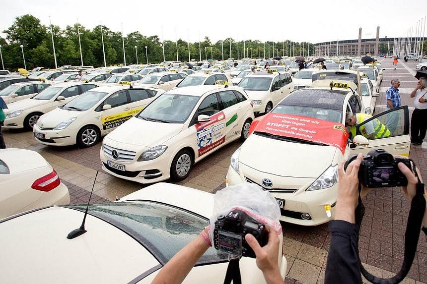 Taxi drivers protesting in Berlin in June 2014 against car-hailing apps such as Uber, which have shaken up the cab-driving industry in cities across the globe. Uber on Thursday said it would appeal against a move by Berlin to ban it for not offering 