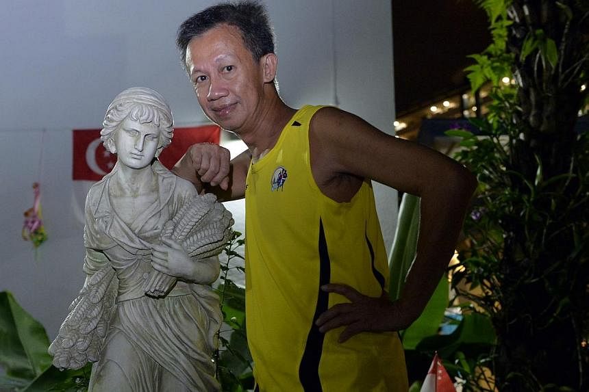 Singapore permanent resident Mr Albert Yam, a self-proclaimed naturist, turned himself&nbsp;in at the district police headquarters in Balik Pulau on Saturday, Aug 16, 2104. -- ST PHOTO: DESMOND FOO
