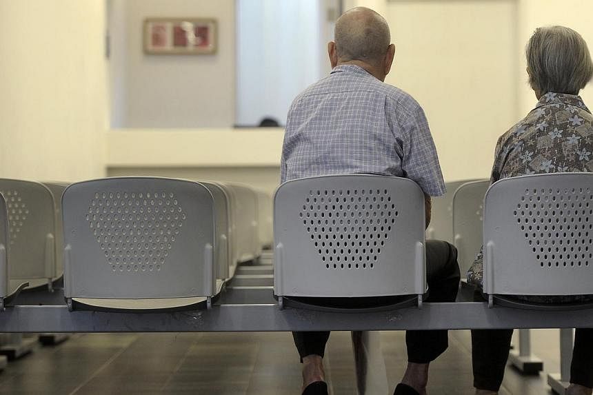 An elderly couple at the Choa Chu Kang Polyclinic.&nbsp;Prime Minister Lee Hsien Loong in his National Day Rally speech said more must be done to help about 10 to 20 per cent of elderly Singaporeans who do not have enough savings in their Central Pro