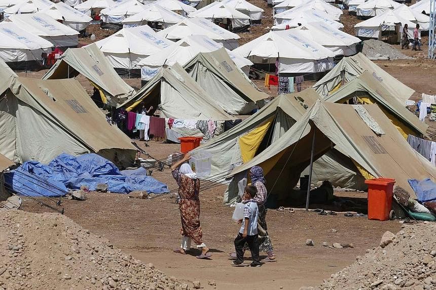 Refugees at Nowruz refugee camp,&nbsp;in Qamishli, north-eastern Syria,&nbsp;where displaced people from the minority Yazidi sect who fled the violence in the Iraqi town of Sinjar are seeking refuge, on Aug 16, 2014.&nbsp;Australia will offer to rese