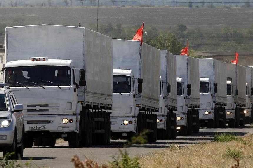 A Russian convoy of trucks carrying humanitarian aid for Ukraine drives along a road from Kamensk-Shakhtinsky in the direction of the border with Ukraine, Rostov Region, Aug 17, 2014.&nbsp;Russian and Ukrainian border guards and custom officials have