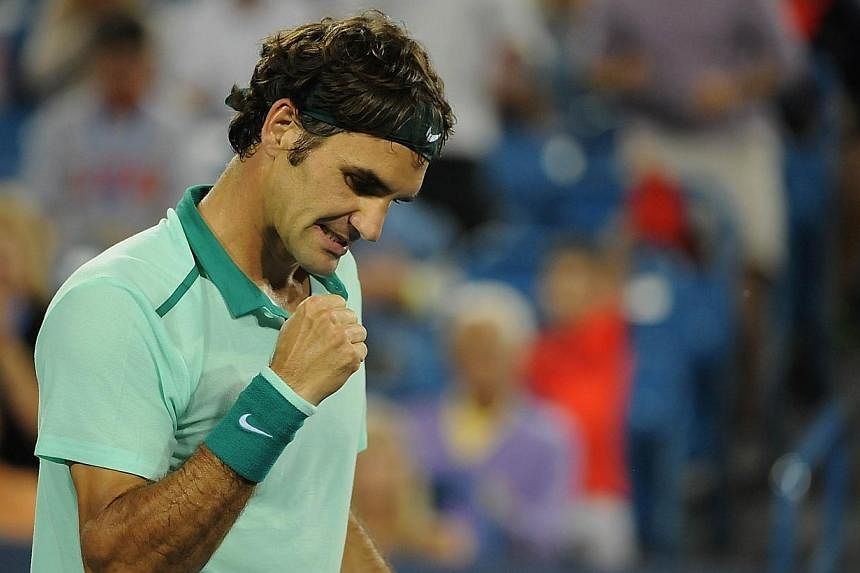 Roger Federer of Switzerland celebrates after winning against Milos Raonic of Canada on day 8 of the Western &amp; Southern Open at the Linder Family Tennis Center on Aug 16, 2014 in Cincinnati, Ohio.&nbsp;Five time champion Roger Federer continued h