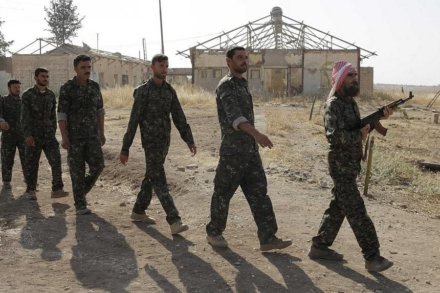 Iraqi volunteers from the Yazidi sect participate in a training camp at the Serimli military base, which is controlled by the Kurdish People's Protection Units (YPG), in Qamishli, northeastern Syria on the border with Kurdistan on Aug 16, 2014.&nbsp;