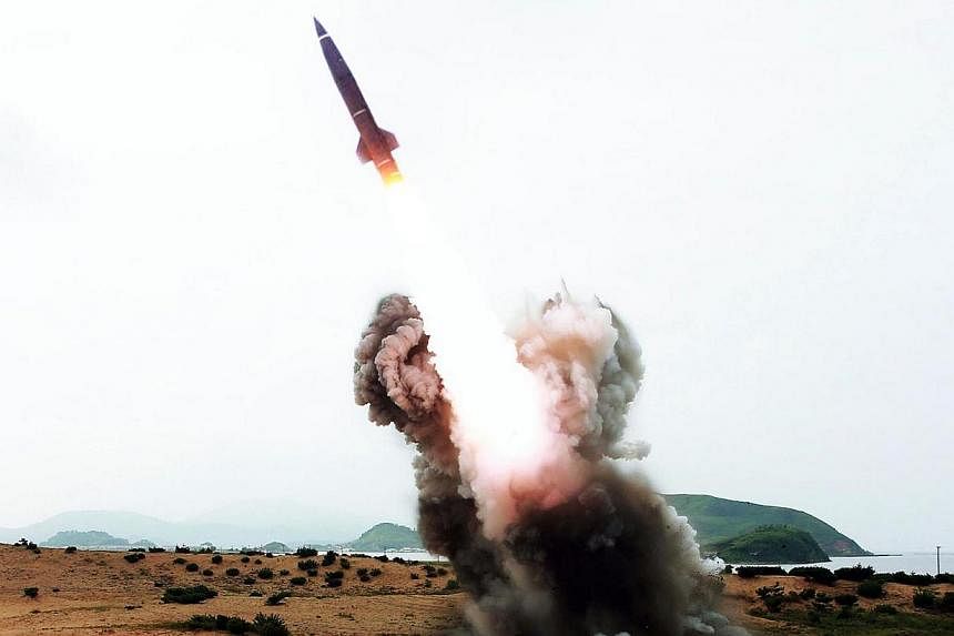 This undated picture released from North Korea's official Korean Central News Agency on August 15, 2014 shows a test firing of a newly developed high-performance tactical rocket at undisclosed place in North Korea. -- PHOTO: AFP