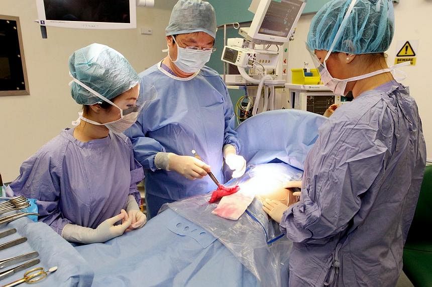 A surgical procedure at KK Women's and Children's Hospital. -- PHOTO: LIANHE ZAOBAO